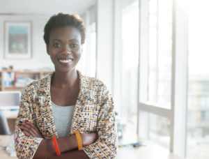 Confident woman standing in workplace